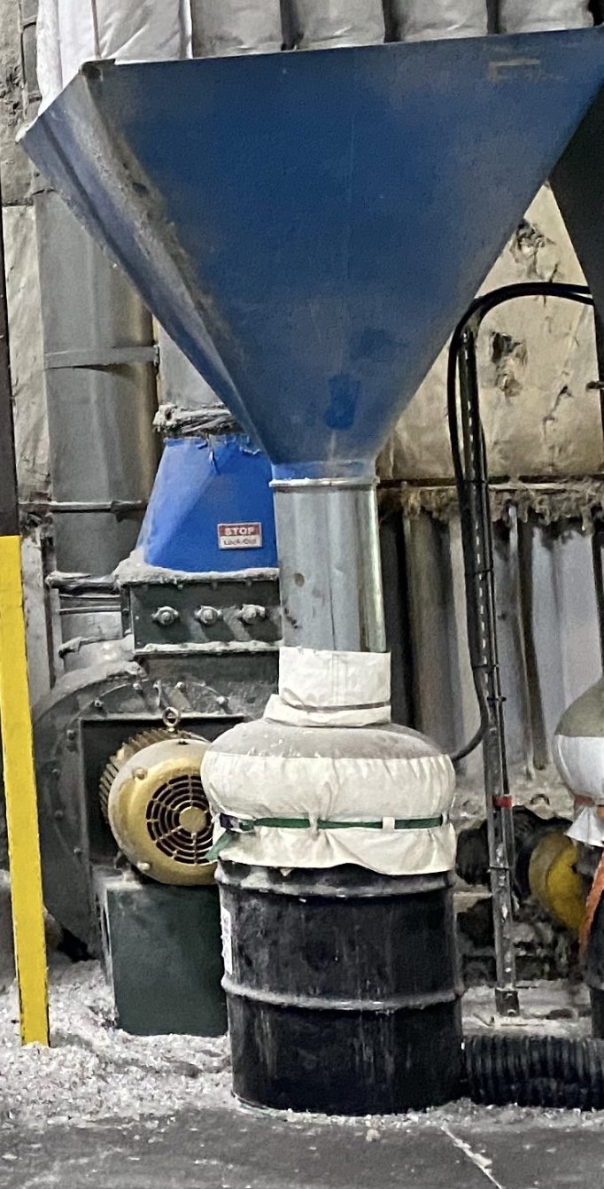 Dust collector discharge into barrel with fabric adapter